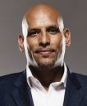This image is of John Amaechi a speaker who may be booked through Parliament Speakers for public speaking engagements